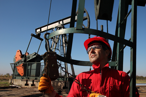 Oil worker on pump site