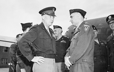 Eisenhower speaks with Lucius Clay