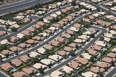 Similarly shaped and sized houses in a suburban neighborhood