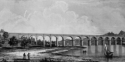An old aquaduct spans a river